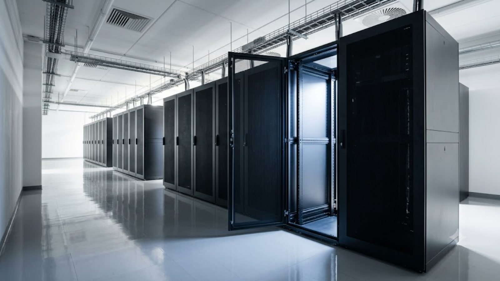 A single unmarked server rack door standing open in an empty white hall